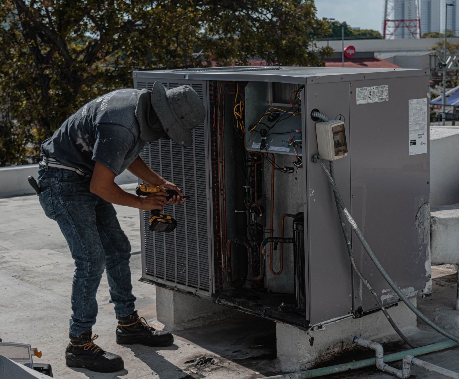 AC repair on a rooftop